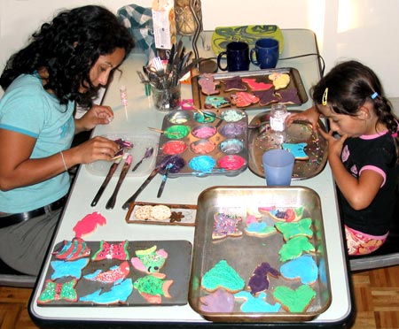 Marisa and Maya decorating home-made cookies